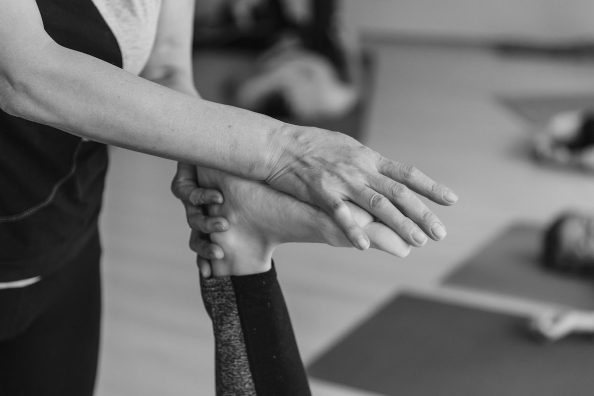 Rehabilitation specialist at work with a patient performing joint exercises
